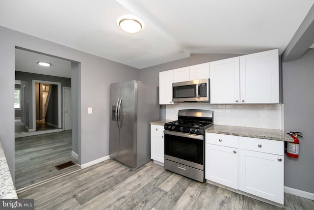 133 E Federal St, Burlington, NJ 08016 - kitchen with stainless steel appliances, light wood-style flooring, decorative backsplash, and white cabinets