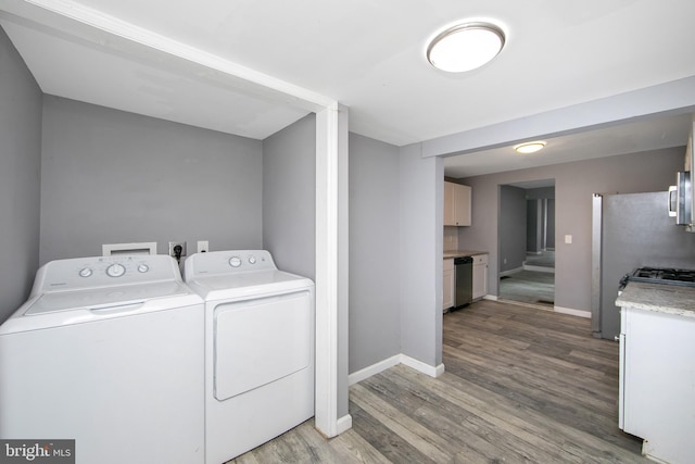 133 E Federal St, Burlington, NJ 08016 - laundry area with washer and clothes dryer, wood finished floors, and baseboards