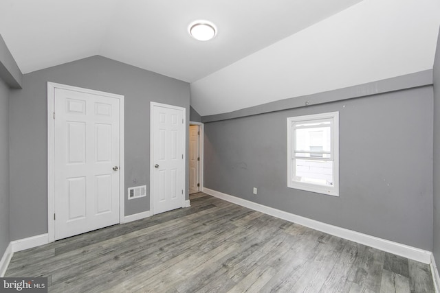 133 E Federal St, Burlington, NJ 08016 - additional living space with vaulted ceiling, wood finished floors, and baseboards