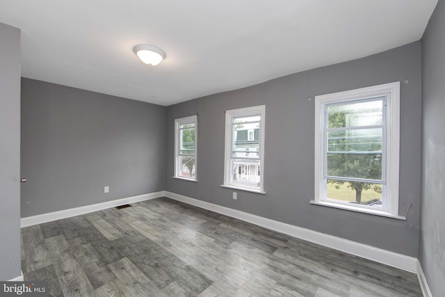 133 E Federal St, Burlington, NJ 08016 - spare room with wood finished floors, plenty of natural light, and baseboards