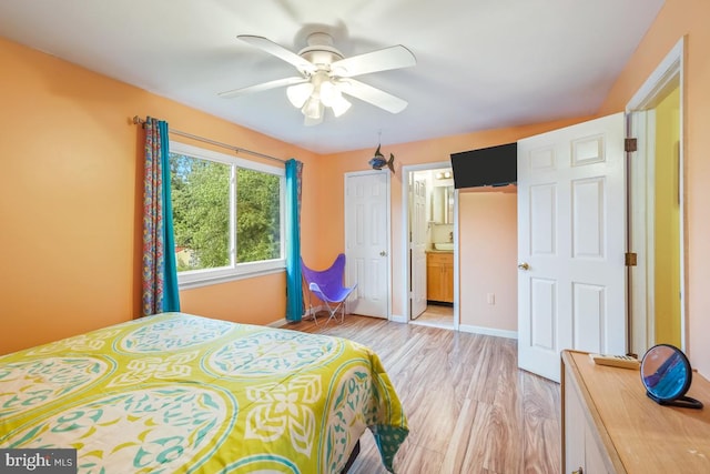7719 Haines Ct, Laurel, MD 20707 - bedroom featuring light wood-type flooring, ensuite bathroom, and a ceiling fan