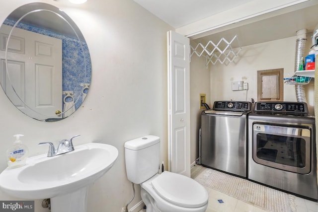 7719 Haines Ct, Laurel, MD 20707 - bathroom with washing machine and clothes dryer and a sink