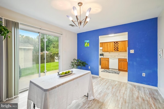 7719 Haines Ct, Laurel, MD 20707 - dining area with a chandelier and light wood-style flooring