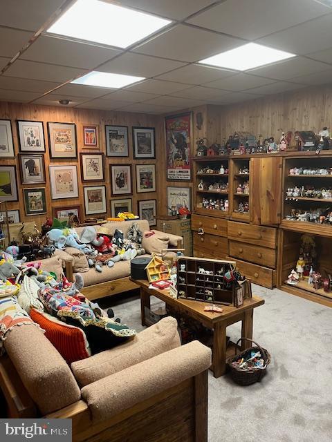 46 Carriage Stop Pl, Florence, NJ 08518 - living area featuring a drop ceiling, carpet floors, and wood walls