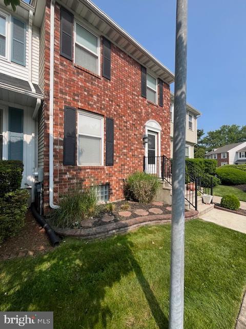 46 Carriage Stop Pl, Florence, NJ 08518 - view of property featuring a front yard and brick siding
