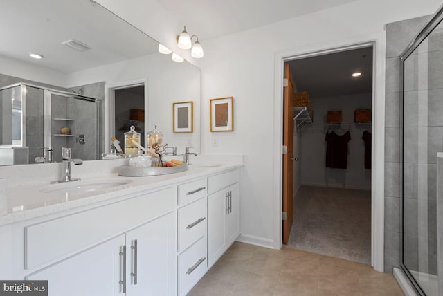 478 Ensemble Way, Frederick, MD 21701 - full bathroom with a walk in closet, double vanity, a shower stall, and tile patterned floors