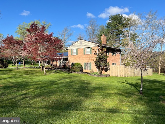 201 Mowbray Rd, Silver Spring, MD 20904 - rear view of house featuring a chimney and solar panels
