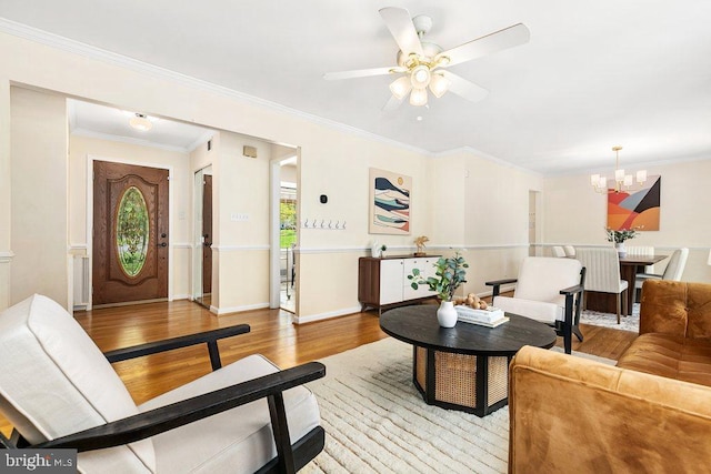 201 Mowbray Rd, Silver Spring, MD 20904 - living area with light wood-style floors, a chandelier, a ceiling fan, and ornamental molding
