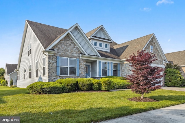 31746 Chablis Ln Unit 71, Lewes, DE 19958 - craftsman inspired home featuring stone siding, a front yard, and roof with shingles