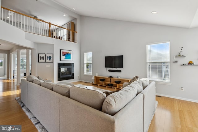31746 Chablis Ln Unit 71, Lewes, DE 19958 - living area with decorative columns, plenty of natural light, wood finished floors, high vaulted ceiling, and recessed lighting