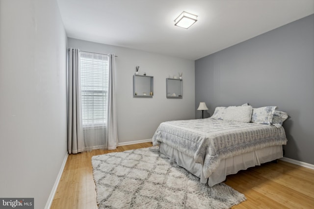 31746 Chablis Ln Unit 71, Lewes, DE 19958 - bedroom with light wood-style floors and baseboards