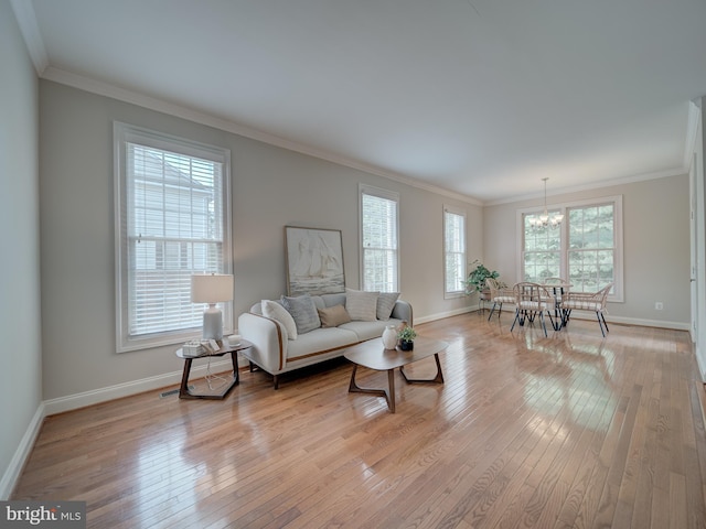 8320 Dockray Ct, Lorton, VA 22079 - living room with a chandelier, light wood-style floors, and crown molding