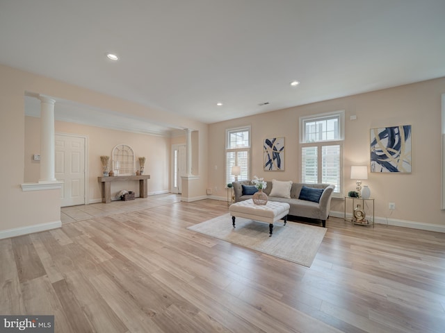 8320 Dockray Ct, Lorton, VA 22079 - living room featuring ornate columns, wood finished floors, and recessed lighting