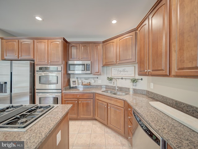 8320 Dockray Ct, Lorton, VA 22079 - kitchen featuring appliances with stainless steel finishes, light tile patterned floors, light stone countertops, and recessed lighting