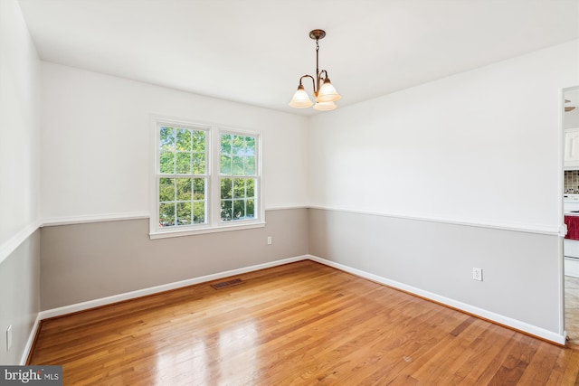 9523 Greencastle Ln, Lorton, VA 22079 - spare room with a chandelier, light wood-type flooring, and baseboards