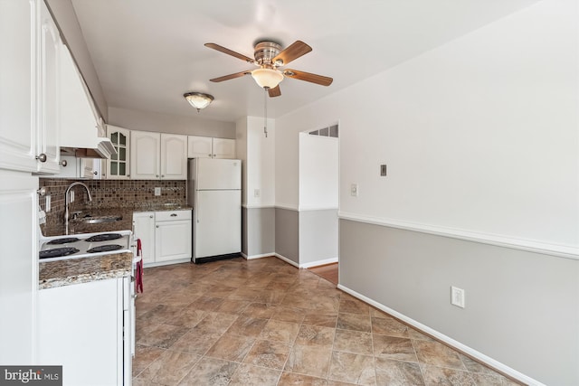 9523 Greencastle Ln, Lorton, VA 22079 - kitchen featuring freestanding refrigerator, a ceiling fan, white cabinetry, tasteful backsplash, and stone finish flooring