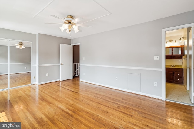 9523 Greencastle Ln, Lorton, VA 22079 - unfurnished bedroom with light wood-style floors, ensuite bathroom, baseboards, and ceiling fan