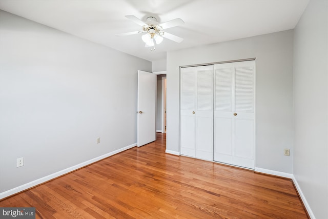 9523 Greencastle Ln, Lorton, VA 22079 - unfurnished bedroom featuring baseboards, light wood-style flooring, a closet, and a ceiling fan