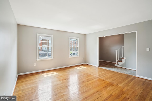 9523 Greencastle Ln, Lorton, VA 22079 - unfurnished room with wood finished floors, stairs, and baseboards