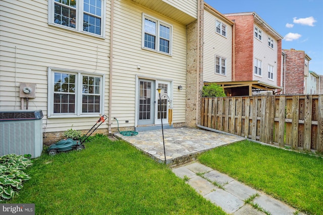 9523 Greencastle Ln, Lorton, VA 22079 - back of house featuring central AC unit and a patio