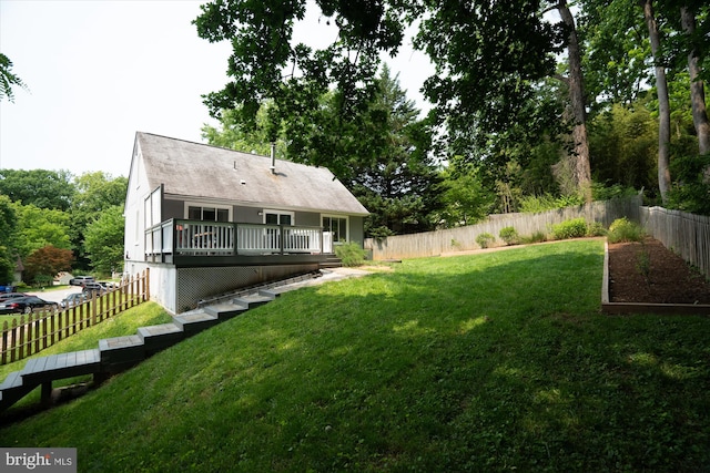 10105 Meredith Ave, Silver Spring, MD 20910 - rear view of property with a wooden deck and a vegetable garden