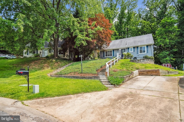 10105 Meredith Ave, Silver Spring, MD 20910 - view of front of property with concrete driveway, a front lawn, and stairway