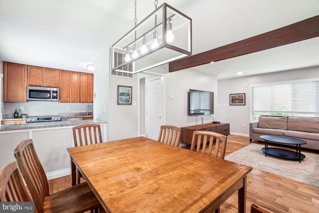 10105 Meredith Ave, Silver Spring, MD 20910 - dining room with light wood-style floors, baseboards, and beam ceiling