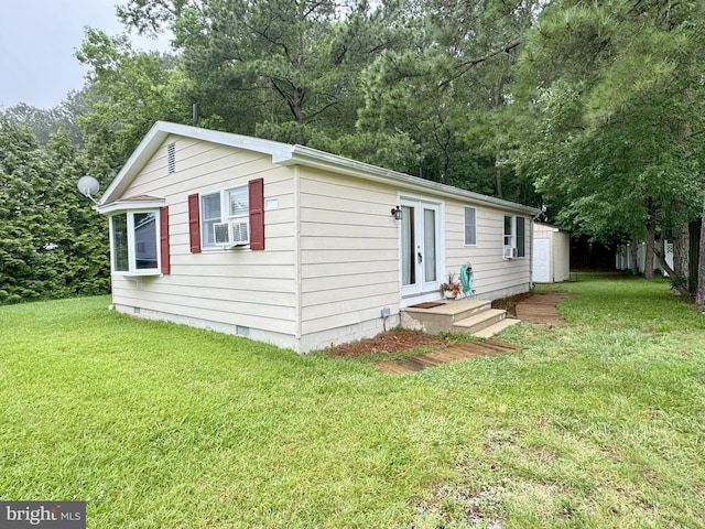 38884 Captains Ln, Selbyville, DE 19975 - manufactured / mobile home with a front yard, cooling unit, and crawl space