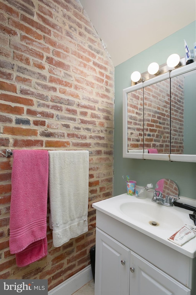 2421 E Madison St E, Baltimore, MD 21205 - bathroom featuring vanity and lofted ceiling