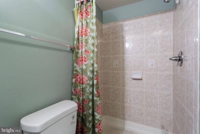2421 E Madison St E, Baltimore, MD 21205 - full bathroom featuring a tile shower and toilet