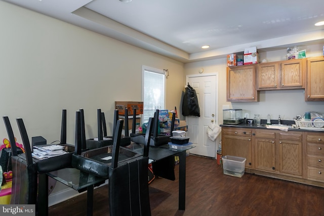 2421 E Madison St E, Baltimore, MD 21205 - kitchen with dark wood-type flooring, brown cabinetry, a raised ceiling, and recessed lighting