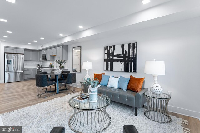 701 N Henry St Unit 212, Alexandria, VA 22314 - living area featuring baseboards, light wood-style flooring, and recessed lighting