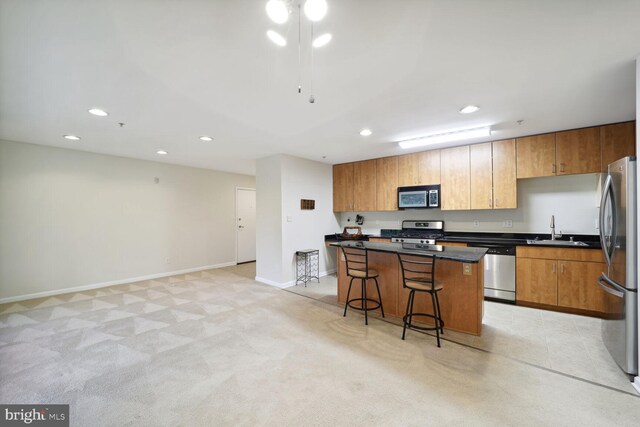 1117 Primrose Ct Unit 304, Annapolis, MD 21403 - kitchen featuring stainless steel appliances, a kitchen island, recessed lighting, a kitchen bar, and dark countertops