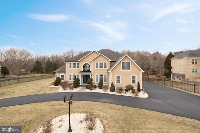 12436 Bacall Ln, Potomac, MD 20854 - traditional home featuring curved driveway and stucco siding
