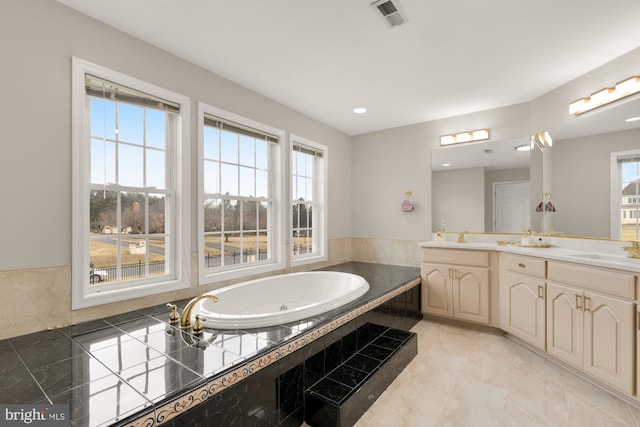12436 Bacall Ln, Potomac, MD 20854 - bathroom featuring plenty of natural light, double vanity, a bath, and recessed lighting