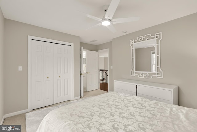 12436 Bacall Ln, Potomac, MD 20854 - bedroom with light colored carpet, baseboards, a closet, and ceiling fan