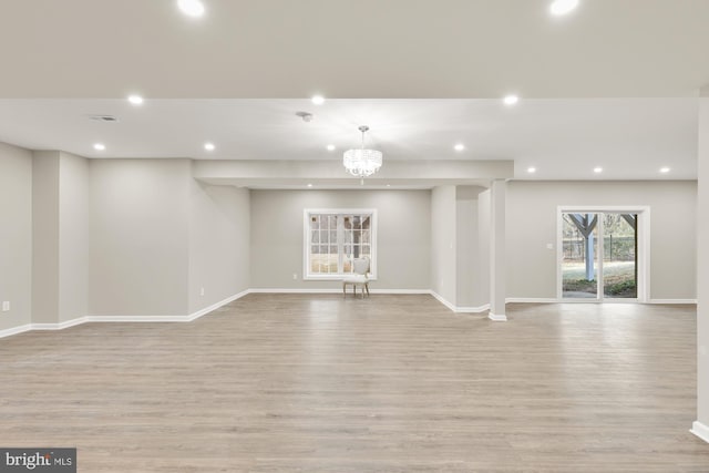 12436 Bacall Ln, Potomac, MD 20854 - unfurnished living room featuring light wood-type flooring, baseboards, and recessed lighting