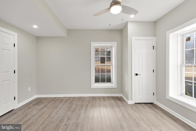 12436 Bacall Ln, Potomac, MD 20854 - empty room with healthy amount of natural light, light wood finished floors, baseboards, a ceiling fan, and recessed lighting
