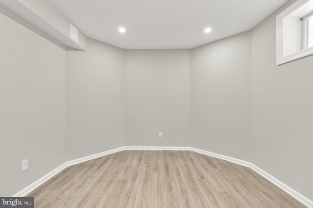 12436 Bacall Ln, Potomac, MD 20854 - basement with wood finished floors, baseboards, and recessed lighting