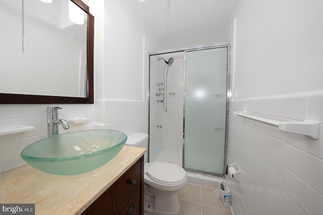 3852 Conshohocken Ave, Philadelphia, PA 19131 - full bathroom featuring tile walls, vanity, a stall shower, toilet, and tile patterned floors