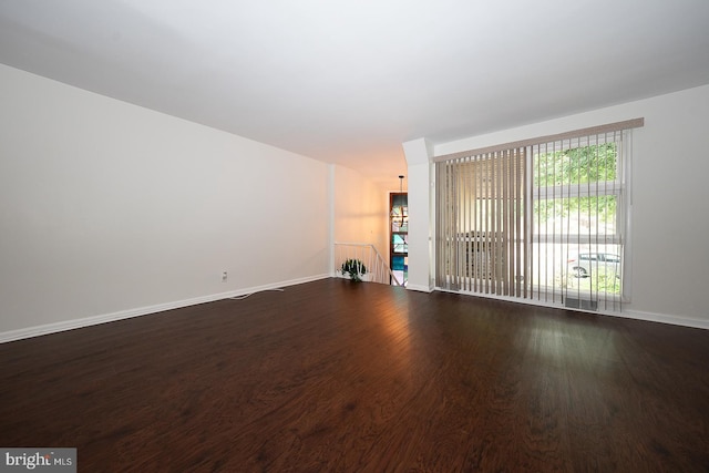 3852 Conshohocken Ave, Philadelphia, PA 19131 - unfurnished living room with dark wood finished floors and baseboards