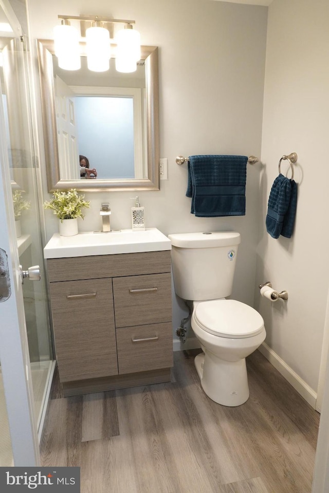 3700 N Rosser St Unit 104, Alexandria, VA 22311 - bathroom with wood finished floors, vanity, and a stall shower
