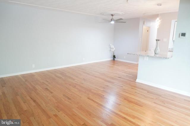 3700 N Rosser St Unit 104, Alexandria, VA 22311 - unfurnished living room with light wood-style floors and a ceiling fan