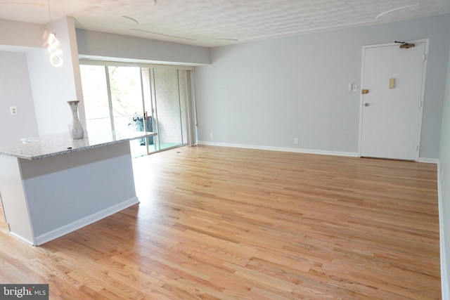 3700 N Rosser St Unit 104, Alexandria, VA 22311 - unfurnished living room featuring light wood-style floors