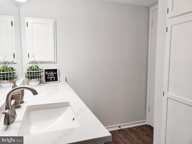 1504 Lincoln Way Unit 305, Mclean, VA 22102 - bathroom featuring wood finished floors and double vanity