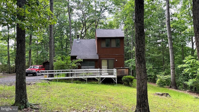 28 Myrtle Dr, Gerrardstown, WV 25420 - view of front of house featuring a shingled roof, a front yard, and a deck