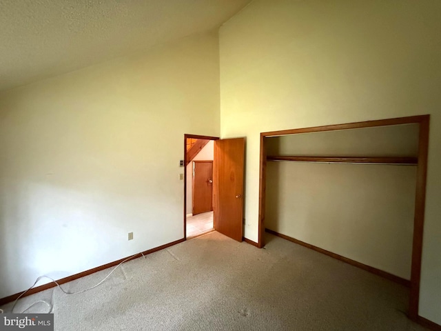 28 Myrtle Dr, Gerrardstown, WV 25420 - unfurnished bedroom featuring carpet, baseboards, a closet, and high vaulted ceiling