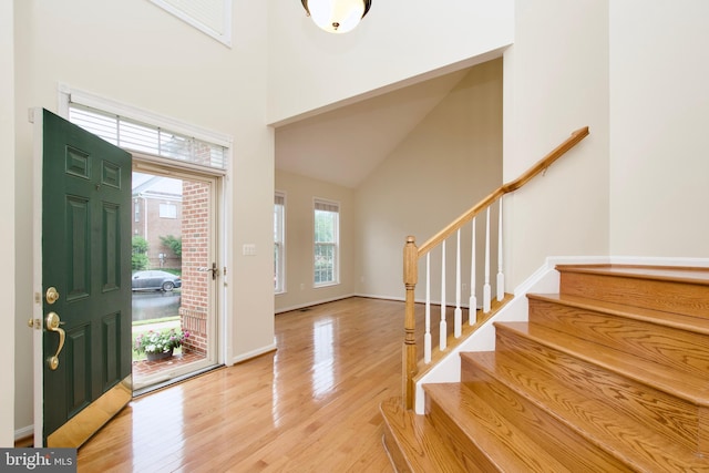 9573 5th Pl, Lorton, VA 22079 - foyer with stairway, light wood finished floors, and a towering ceiling