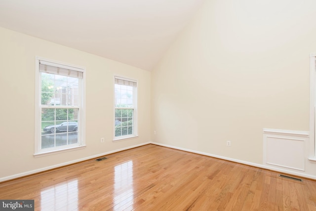 9573 5th Pl, Lorton, VA 22079 - spare room featuring wood finished floors and lofted ceiling