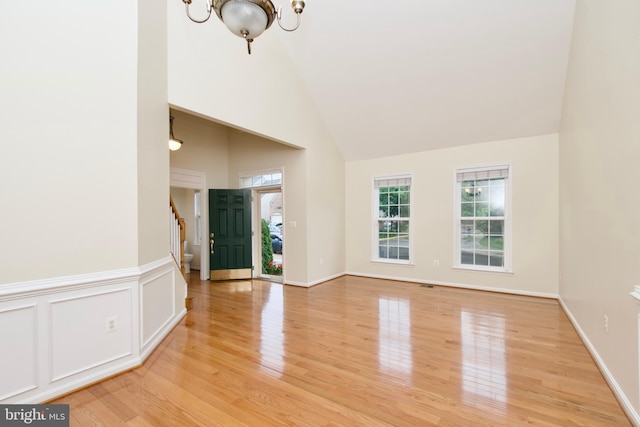 9573 5th Pl, Lorton, VA 22079 - entryway with stairs, a chandelier, high vaulted ceiling, and light wood-style floors